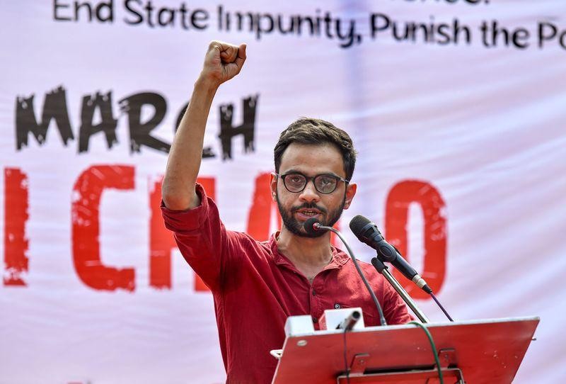 Umar Khalid speaking at a protest with a raised fist